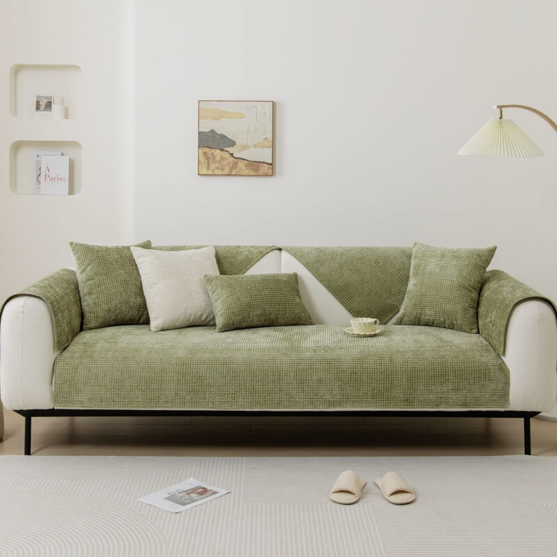 Sectional couch featuring a pet-friendly Textured Waffle Chenille Furniture Protector in black.