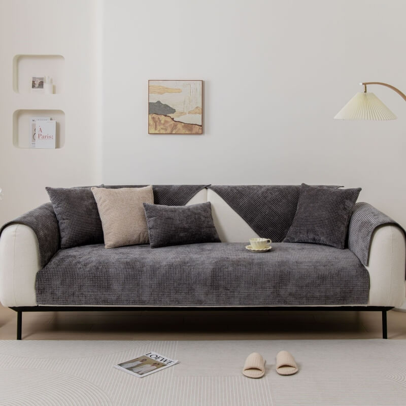 Kids and pets playing on a sofa with a protective and stylish Textured Waffle Chenille Couch Cover.