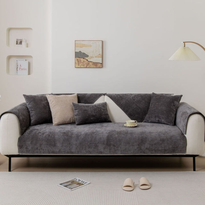 Kids and pets playing on a sofa with a protective and stylish Textured Waffle Chenille Couch Cover.