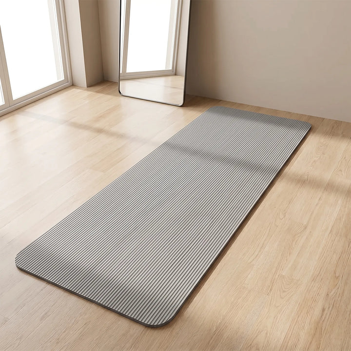 Thick unisex exercise mat for home workouts, yoga, and pilates, offering comfort and support.