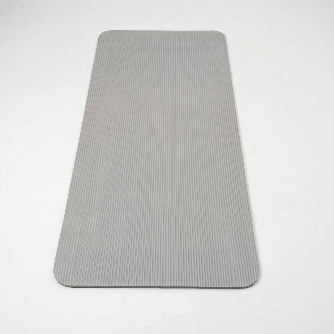 NBR thick exercise mat for joint protection during home workouts, fitness, yoga, and pilates.