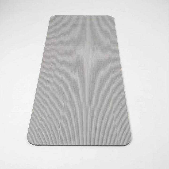 NBR thick exercise mat for joint protection during home workouts, fitness, yoga, and pilates.