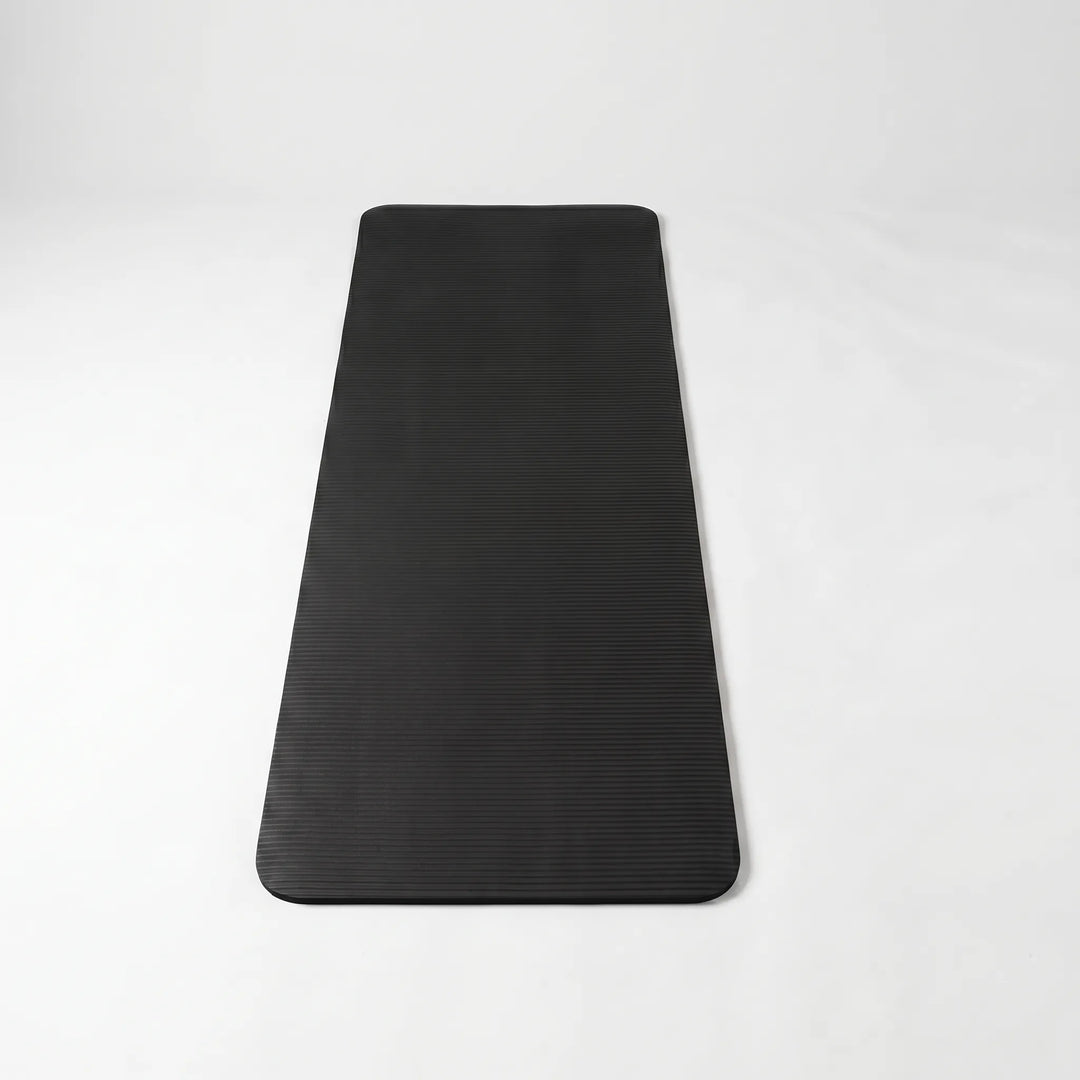 Comfortable thick exercise mat for home yoga, pilates & workouts. Durable, non-slip fitness gear.