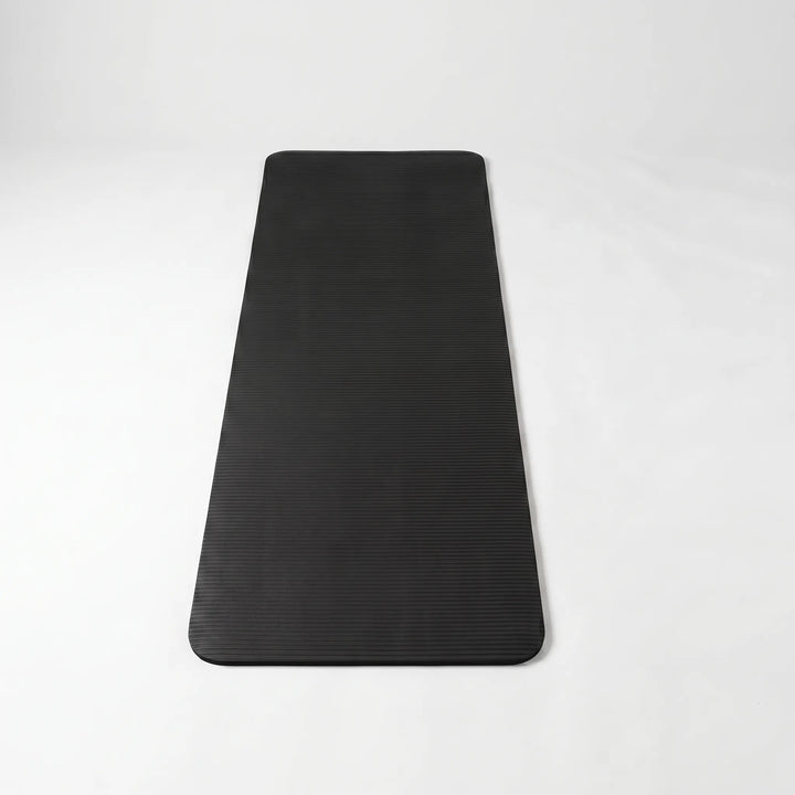 Comfortable thick exercise mat for home yoga, pilates & workouts. Durable, non-slip fitness gear.