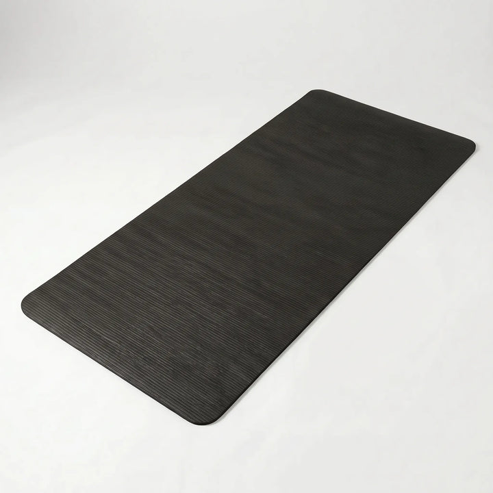 Versatile thick home fitness mat for yoga, pilates, & floor exercises. Non-slip & durable workout gear.