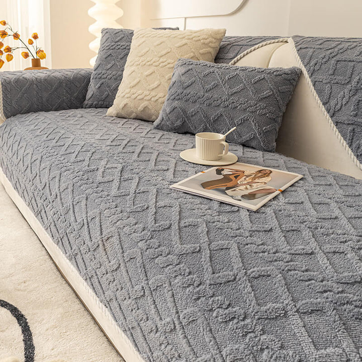 Thickened plush non-slip sofa cover in a neutral color, perfect for pet owners, protecting furniture.