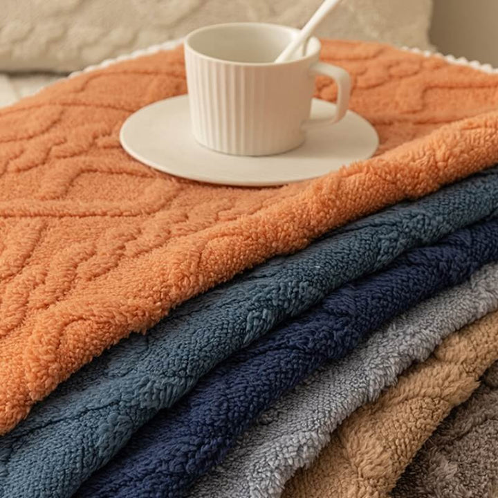 Unisex thickened plush sofa protector draped over a couch, ensuring a non-slip, pet-friendly surface.