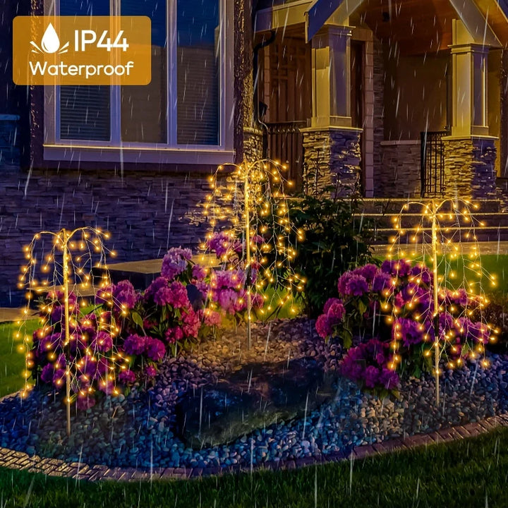 Close-up of a solar-powered garden light with multiple LED strands, ideal for lawn decoration.