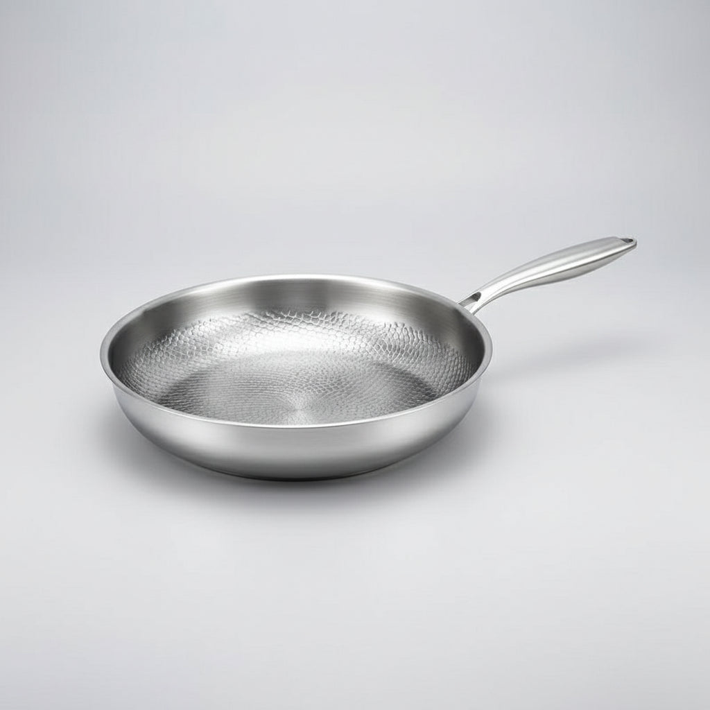 Modern kitchen non-stick titanium hammered skillet. Induction ready frying pan for delicious meals, durable.