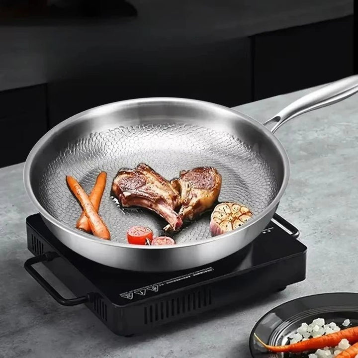 Premium titanium non-stick skillet with hammered finish. Induction-ready frying pan for easy, healthy cooking.