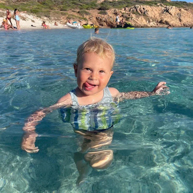 Toddler boys' swim vest with SPF 50+ & built-in shorts for pool play.
