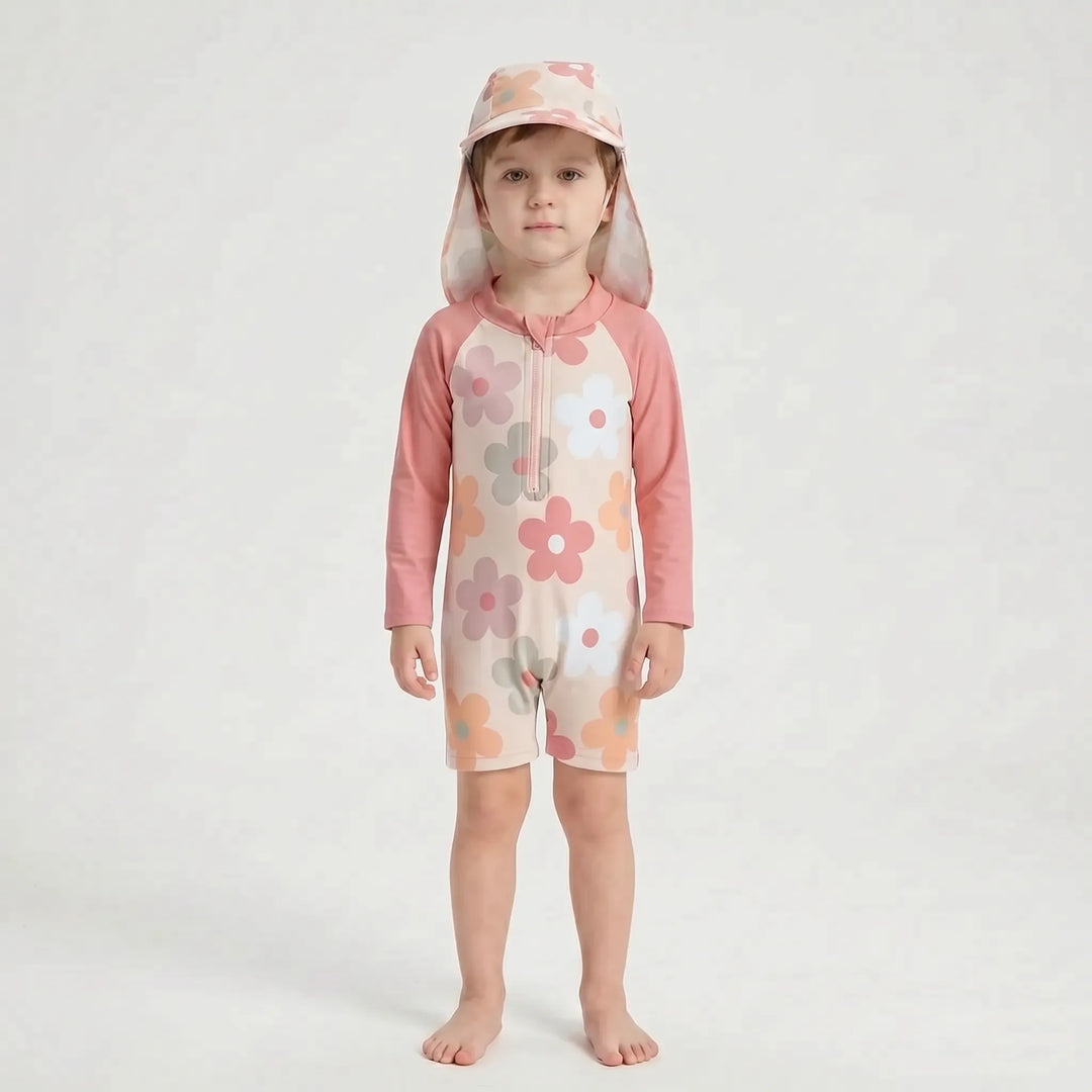 Easy-on long-sleeve rash guard one-piece swimsuit for toddlers with included sun protection swim hat.