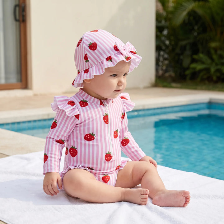 Toddler long-sleeve rashguard swimsuit with UPF 50+ sun protection, matching swim hat & easy zipper closure.