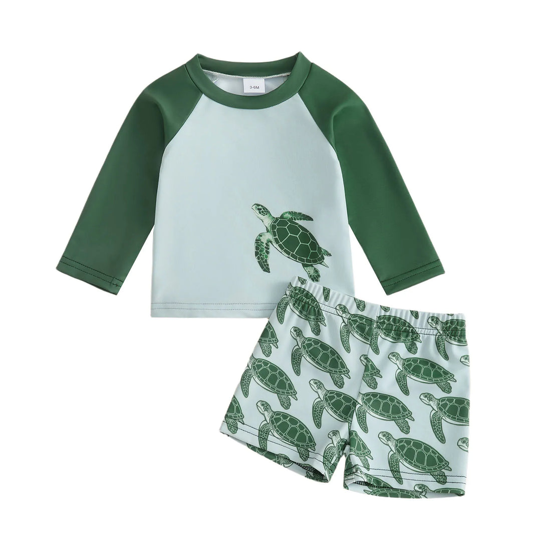 Playful tortoise print toddler long-sleeve swim set, ideal for sun protection during beach & water activities.
