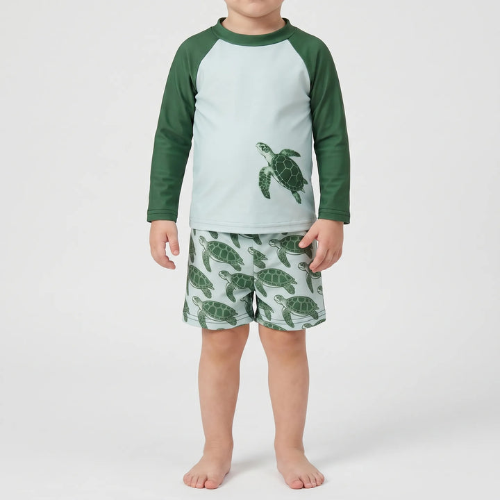 Cute toddler long-sleeve rash guard set featuring a playful tortoise print. Ideal kids swimwear for summer.