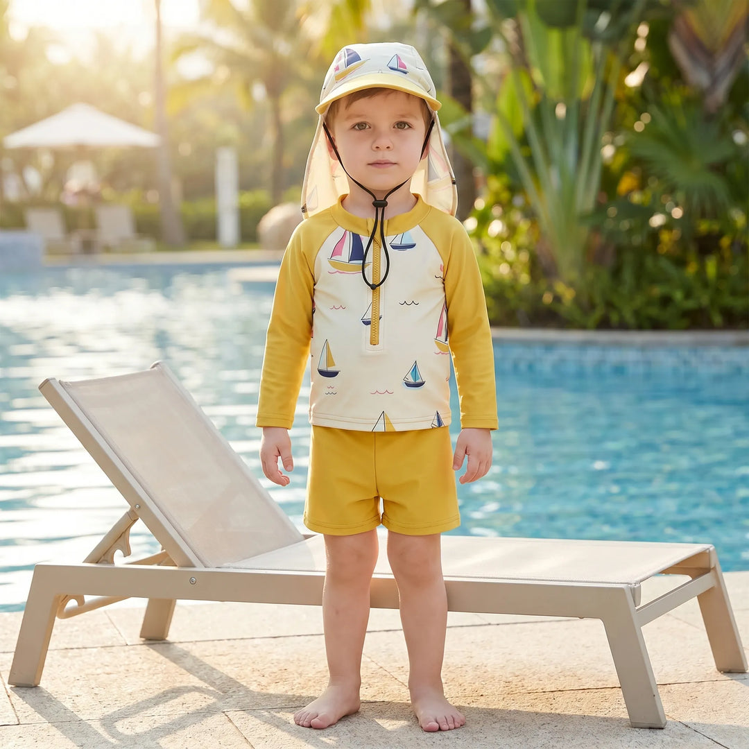 Toddler's 3-piece sun protection swim set with blue rash guard, matching shorts, and wide-brim hat.