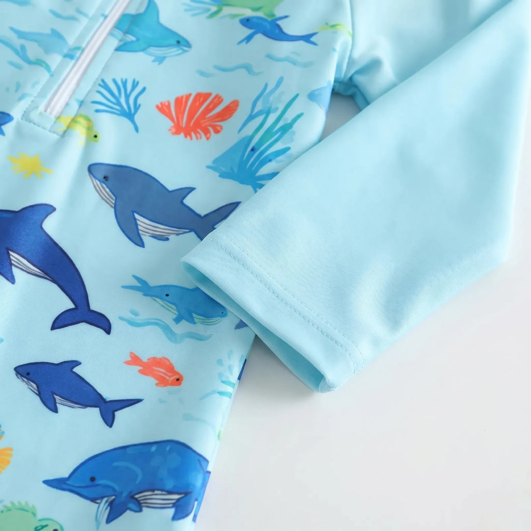 Comfortable toddler long-sleeve swim romper & matching hat. Unisex design, perfect for beach & pool.