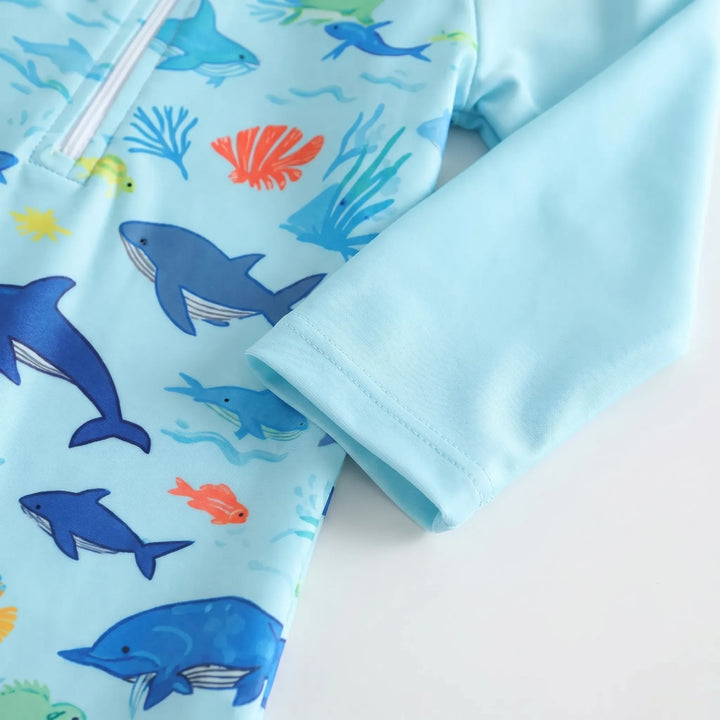 Comfortable toddler long-sleeve swim romper & matching hat. Unisex design, perfect for beach & pool.