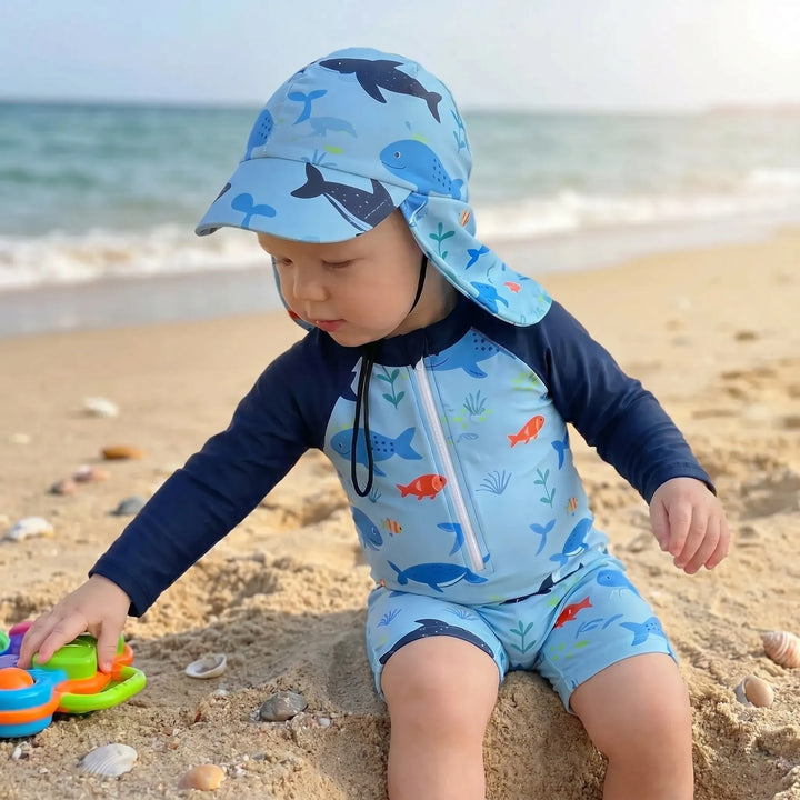 Cute baby long-sleeve swim romper and hat. Unisex ocean print swimwear for summer beach & pool days.