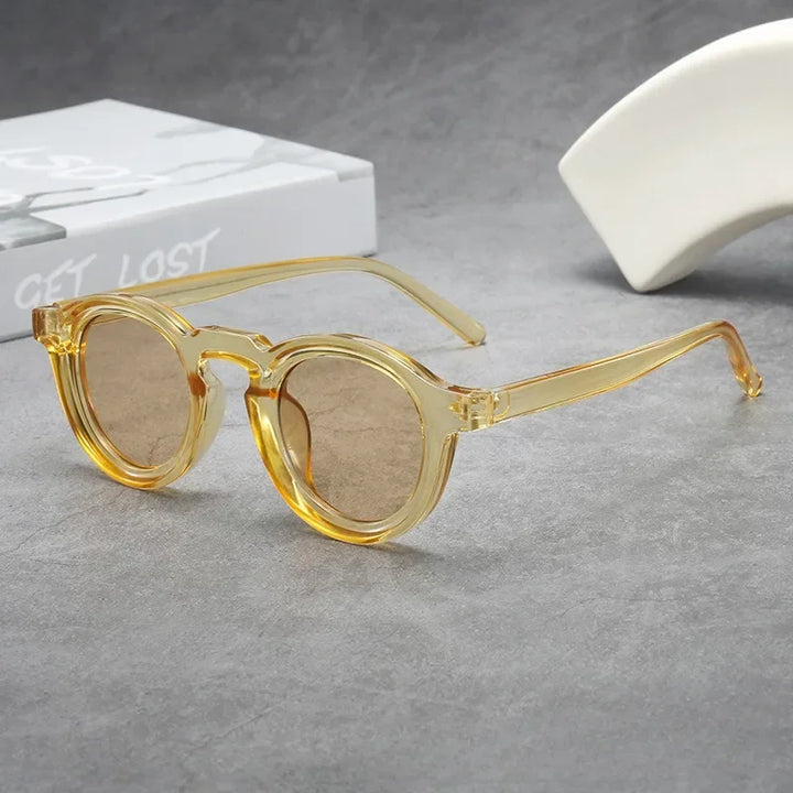Lightweight classic round unisex sunglasses with tinted smoke amber lenses & durable tortoise frame, a fashion accessory.