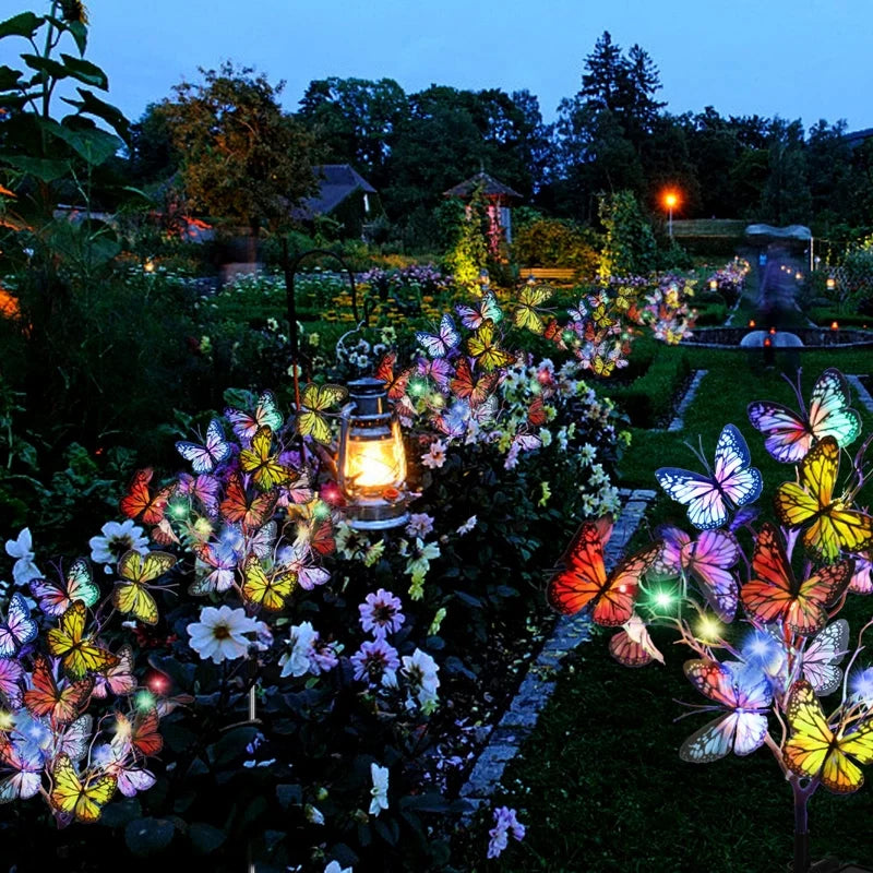 Solar butterfly garden lights glowing softly in an outdoor garden, ideal for evening patio ambiance.