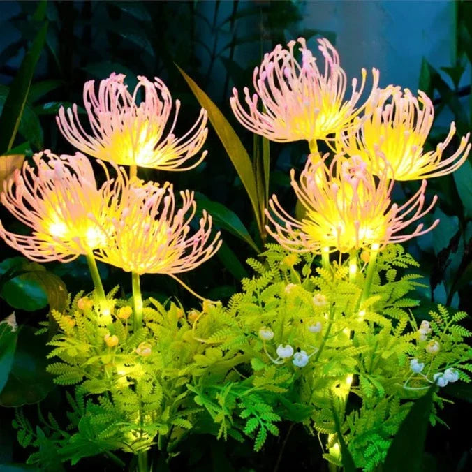 Close-up of a pink LED flower garden stake light with a solar panel, perfect for outdoor decor