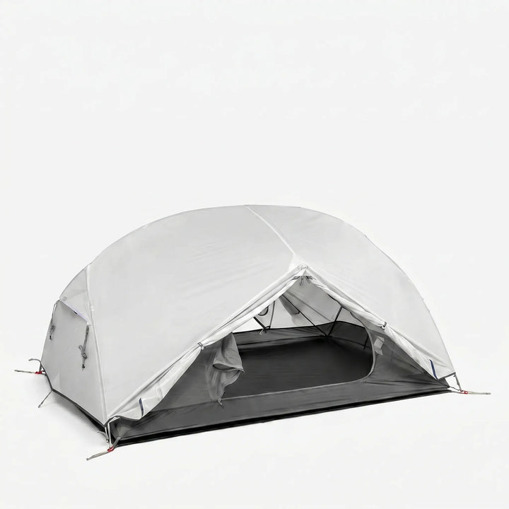 Lightweight 1-3 person backpacking tent pitched in nature. Perfect 3 season outdoor shelter for hiking trips.