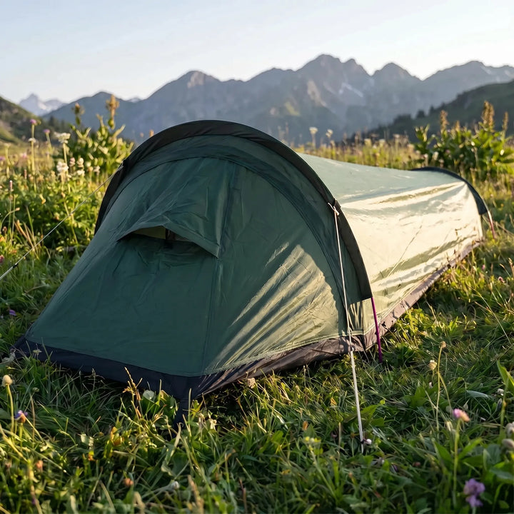 Ultralight 1-person backpacking bivy tent set up in a forest, ideal for solo camping and hiking adventures.