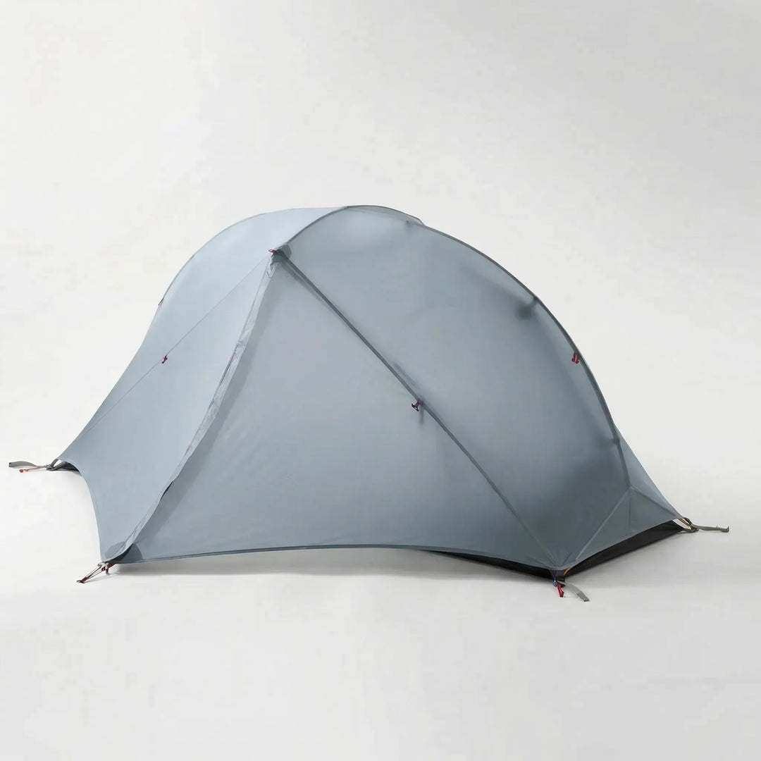 Compact, lightweight 1-person backpacking tent packed in its stuff sack, ready for a hike.