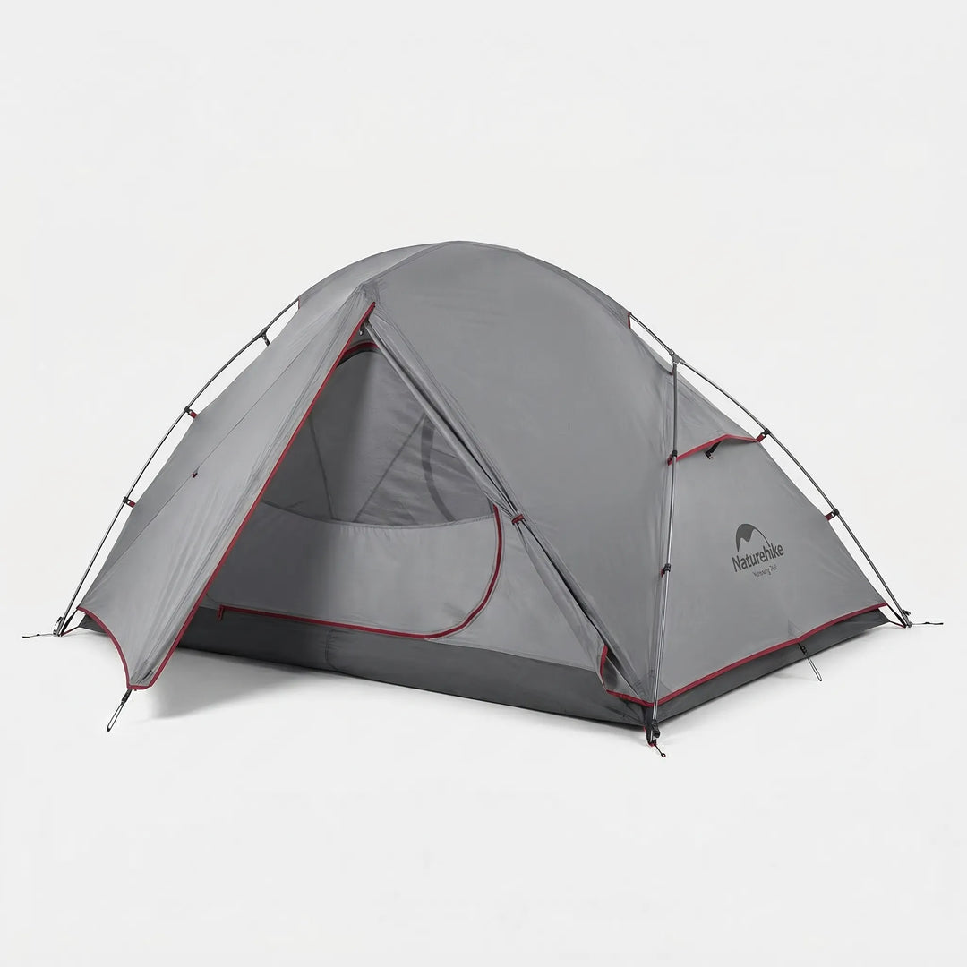 Portable ultralight 2-person tent packed in its carry bag, ready for hiking, backpacking, and outdoor camping trips.