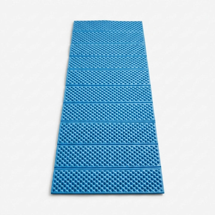 Closed-cell foam sleeping pad for camping. Durable, insulating blue mat ensures comfort during outdoor hiking.