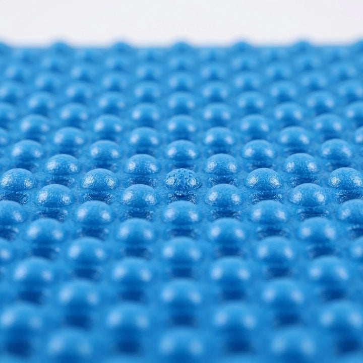 Foldable blue closed-cell foam sleeping pad, ultralight for camping & hiking. Insulating outdoor mat.