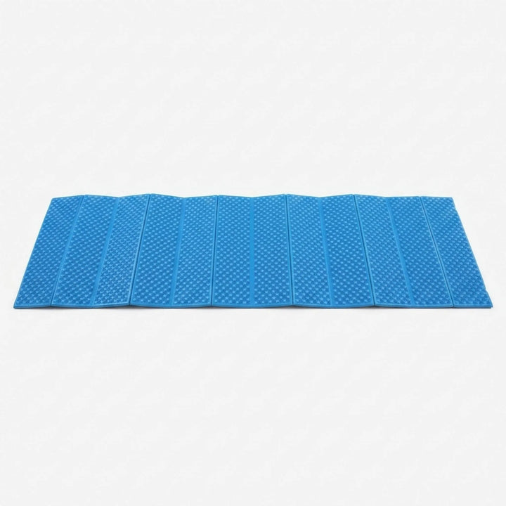 Compact, folded blue ultralight camping mat. Portable closed-cell foam sleeping pad for easy transport on hikes.