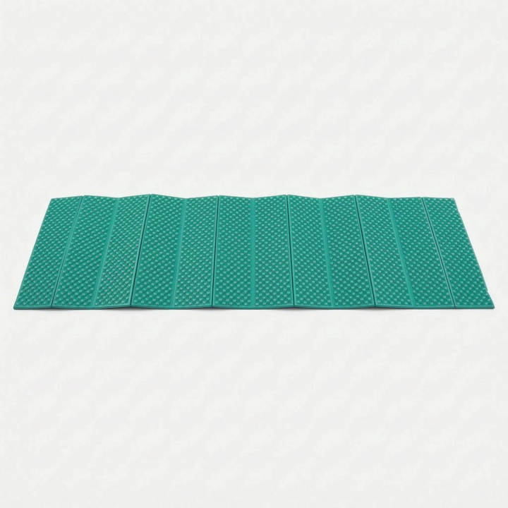 Unfolded blue closed-cell foam sleeping pad. Ultralight camping mat texture for comfortable outdoor sleeping & hiking.