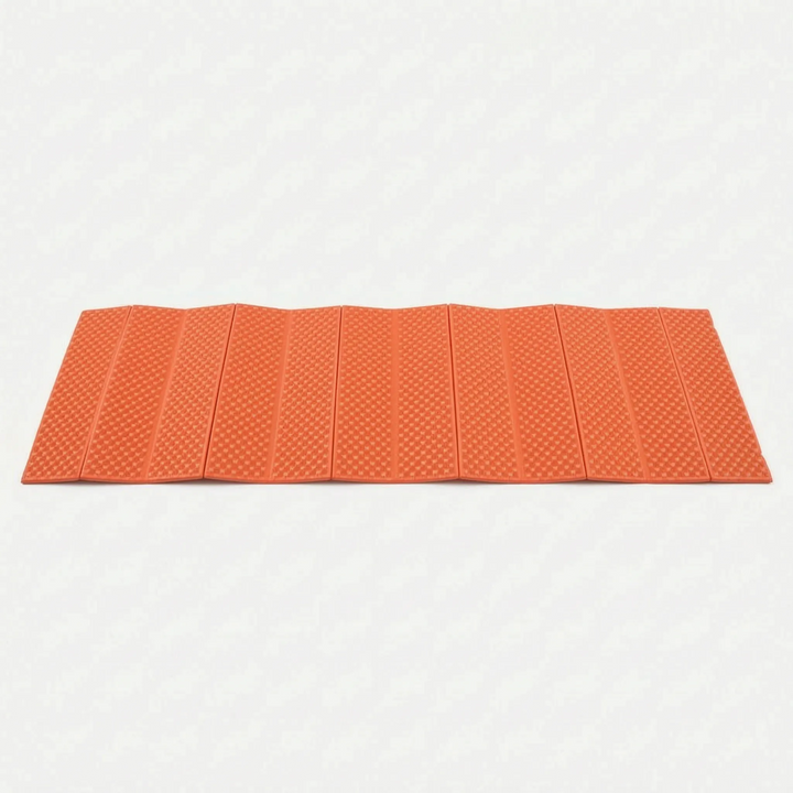 Blue ultralight camping mat on ground, perfect closed-cell sleeping pad for hikers & outdoor camp gear setup.