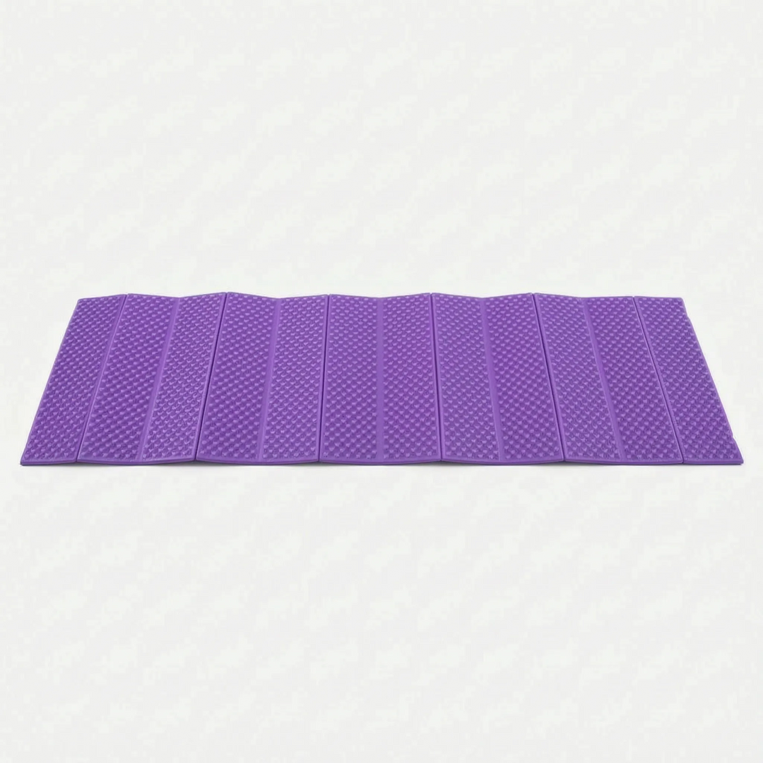 Durable blue ultralight camping mat. Foldable closed-cell sleeping pad for comfortable outdoor recreation & hiking trips.