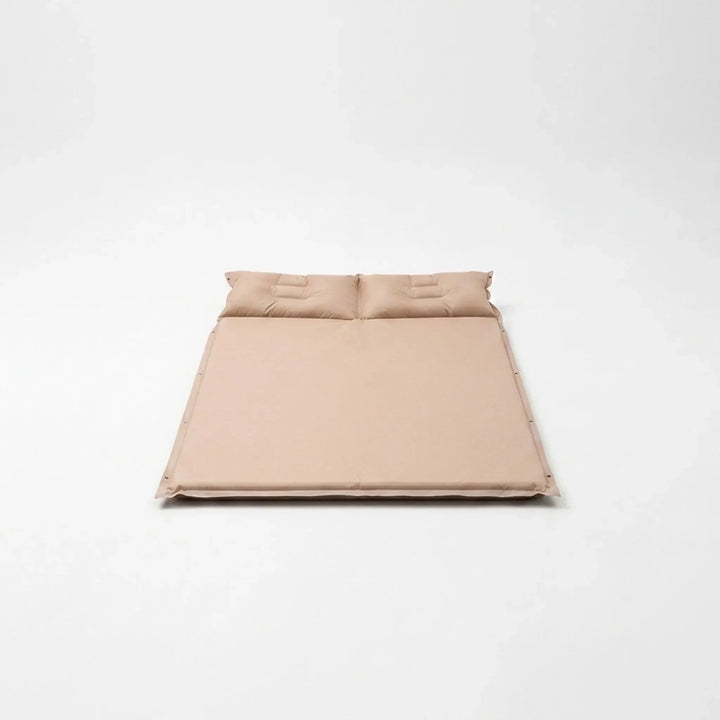 Self-inflating camping sleeping pad, ultralight for outdoor hiking comfort. Essential travel gear for adventurers.