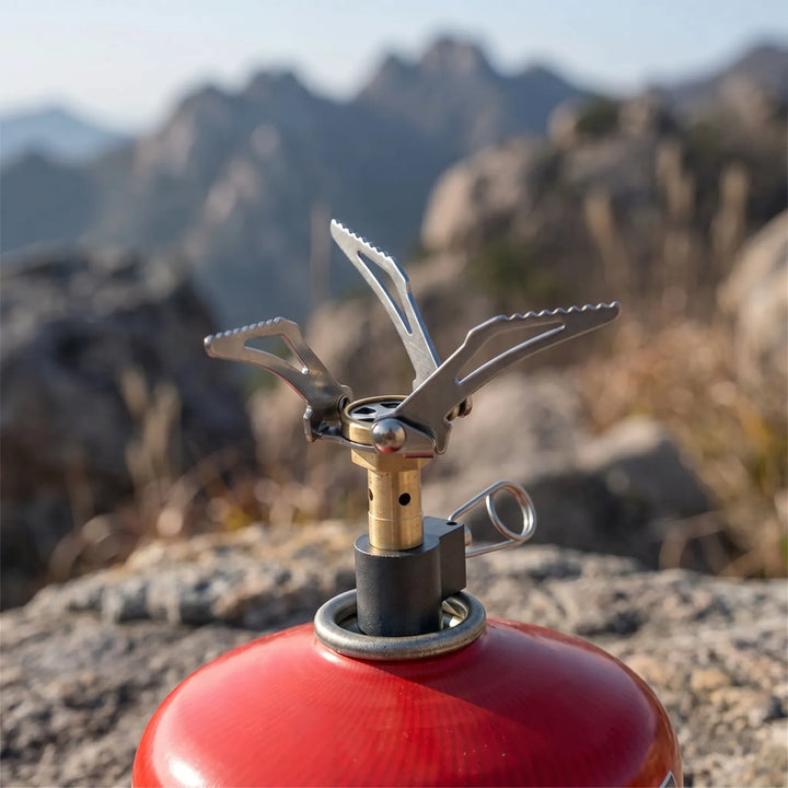 Ultralight compact folding camping gas burner stove, ideal for backpacking & outdoor cooking.