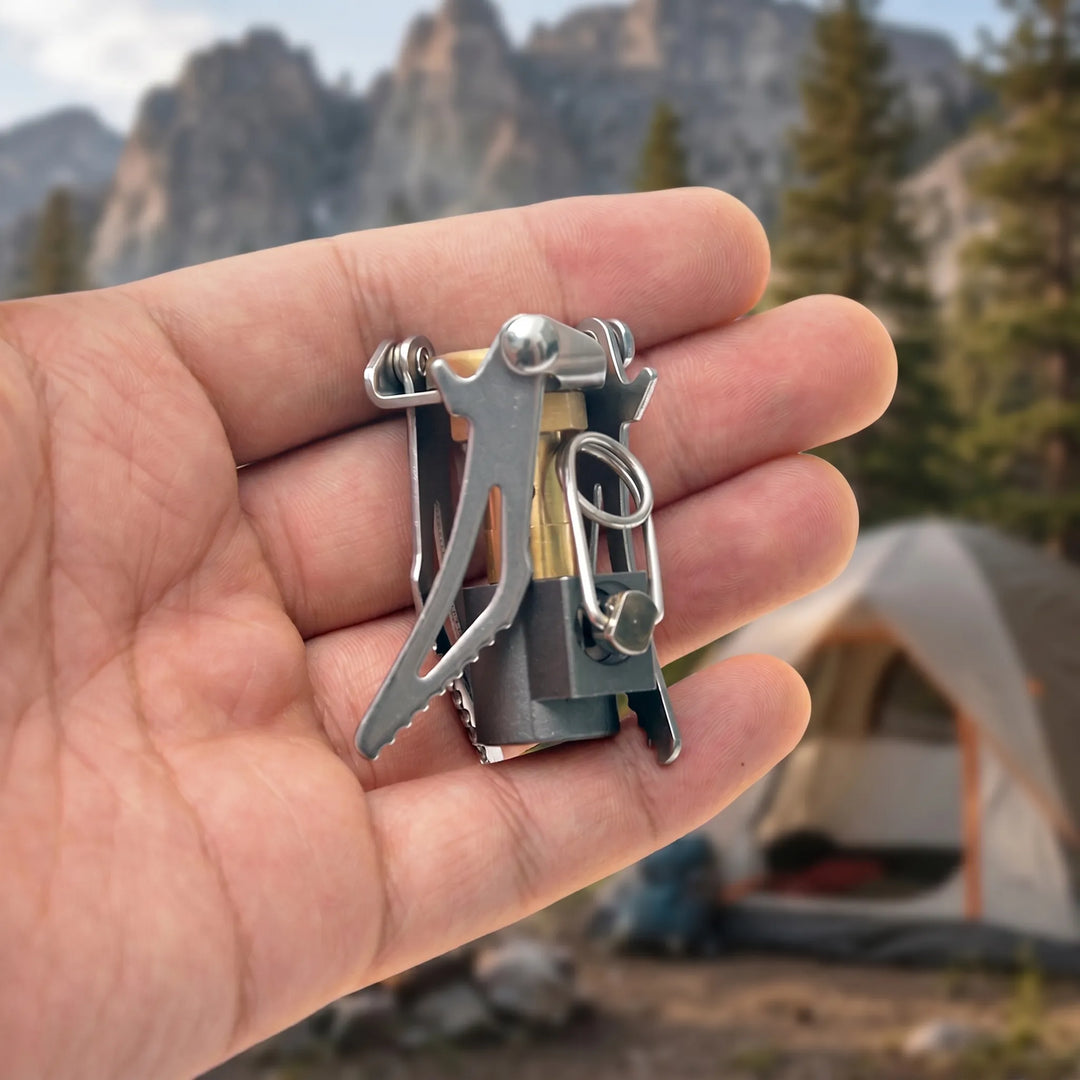 Ultralight folding camping gas stove supporting a pot, perfect for backpacking & survival cooking.
