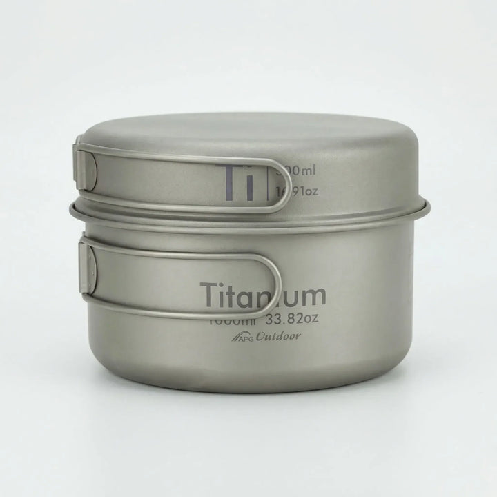 Complete ultralight titanium camping pot and pan set for backpackers, essential outdoor cooking gear.