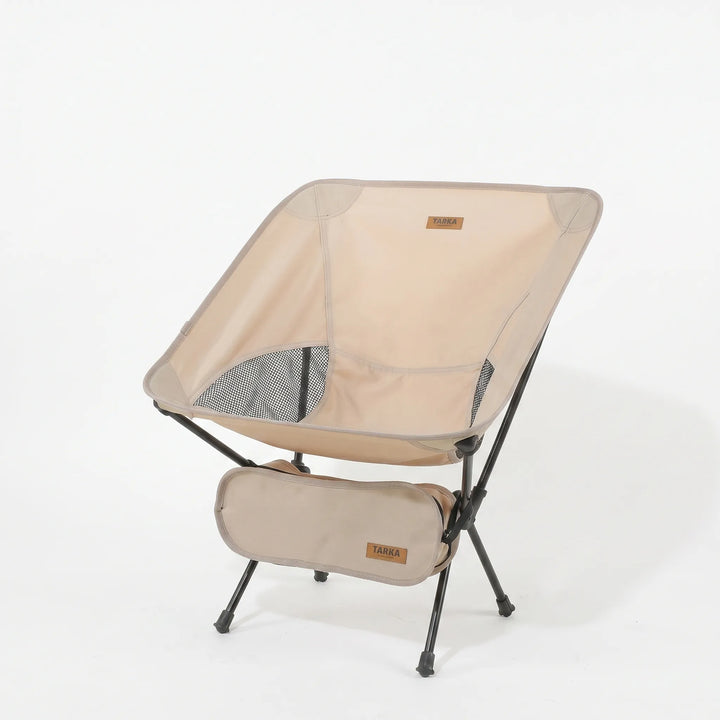 Compact folding camping chair with durable aluminum frame, breathable mesh, and oxford cloth seat for hiking and travel.