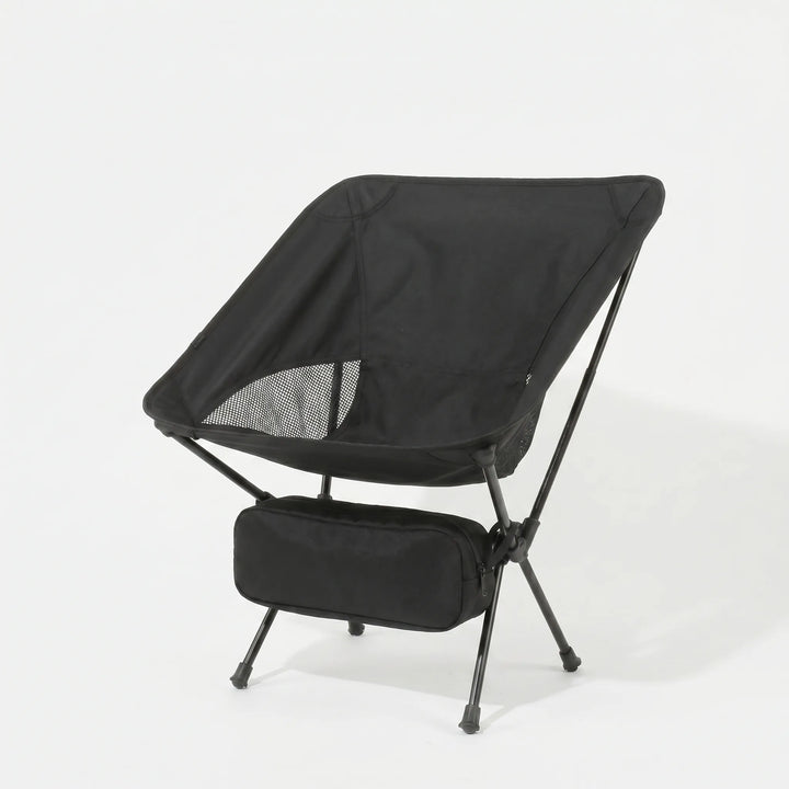 Lightweight folding camping chair in a natural setting, perfect for outdoor adventures, hiking, and comfortable seating.