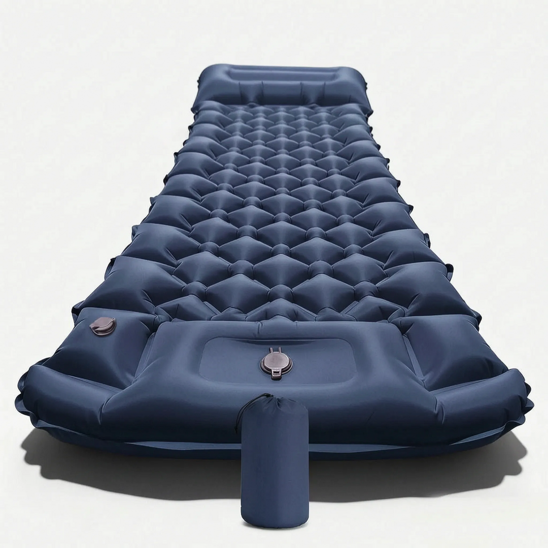 Compact, rolled-up camping sleeping mat with built-in pillow & pump, ready for backpack travel.