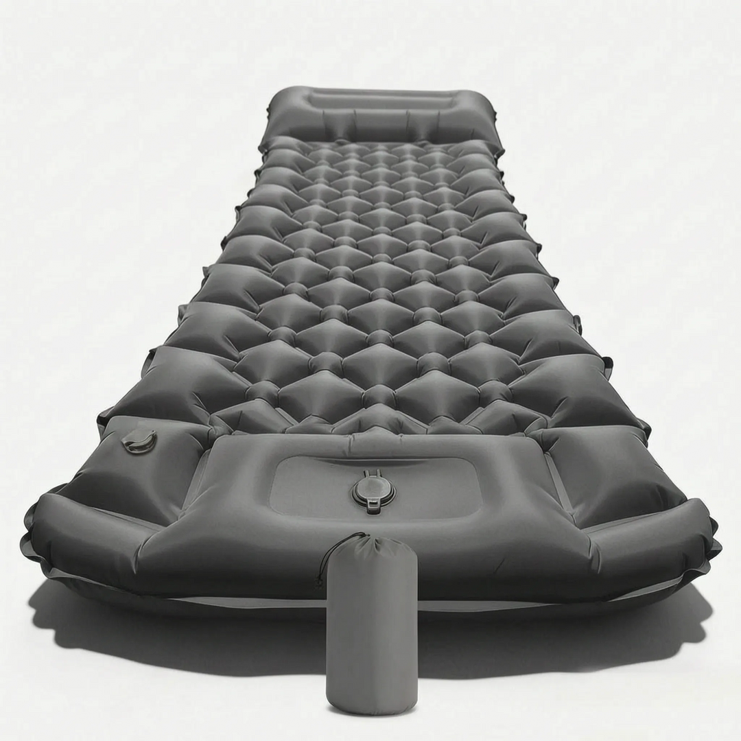 Detail of the built-in pillow on an ultralight inflatable camping sleeping mat, perfect for head support.
