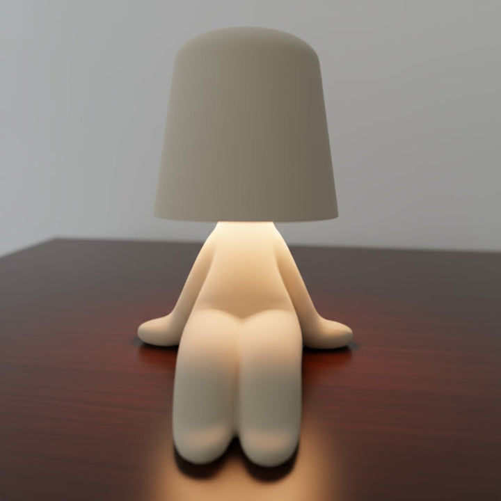 Unique human shape LED lamp, rechargeable desk light for modern decor, creative workspaces, & ambient room lighting.