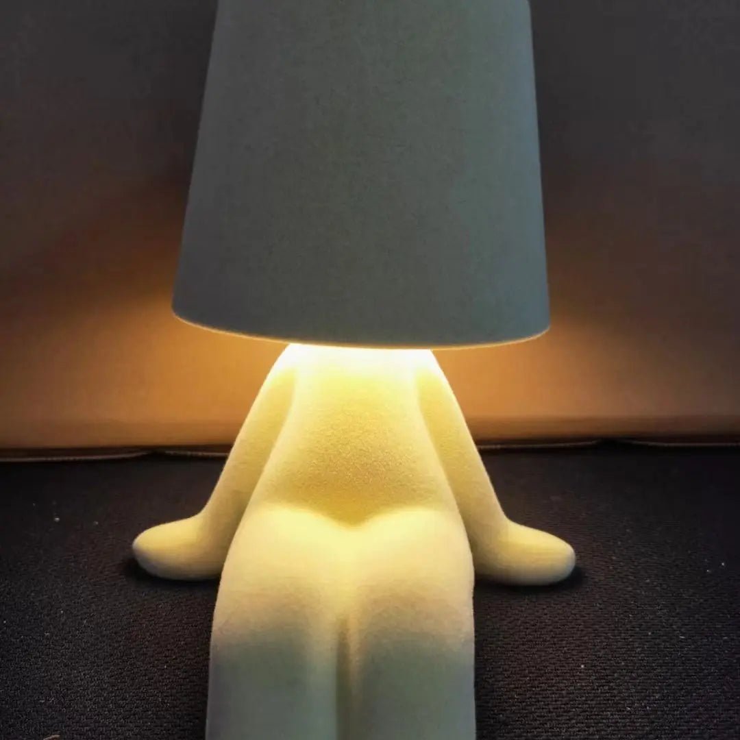 Modern human shape LED lamp, an artistic desk light adding unique flair to any contemporary decor or workspace.