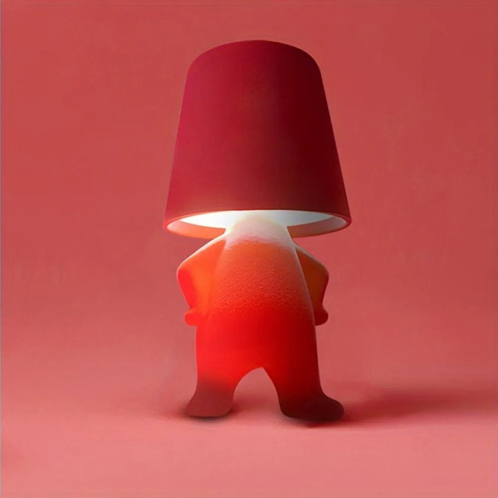 Unique human shape LED desk lamp. Modern artistic rechargeable table light for contemporary decor & creative workspaces.