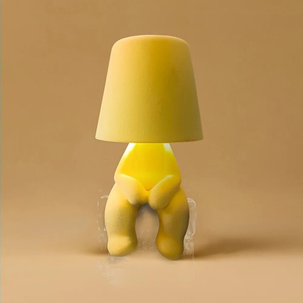 Contemporary human shape LED desk lamp. Artistic rechargeable table light, ideal for modern decor & ambient room lighting.