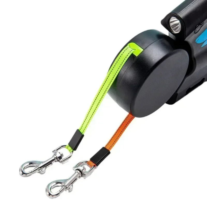 Close-up of ergonomic handle on 3-in-1 dual dog leash with flashlight and poop bag holder