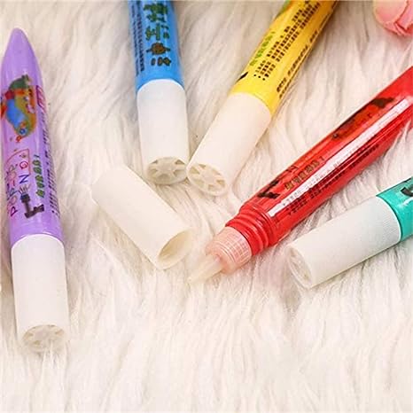 Close-up of a hand drawing with 3D PuffMaster pens, making colorful puffy art designs.